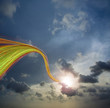 Lines swirling up to sun in sky