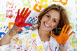 Messy Hispanic woman finger painting