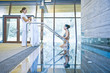 Hispanic woman getting out of hot tub