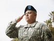 Hispanic soldier saluting