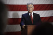 Caucasian politician making speech at podium