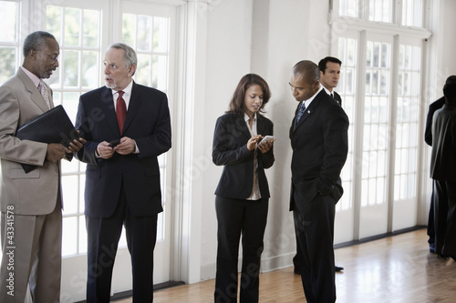 Photo: Business people talking together Business people talking together