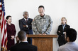Politicians standing at podium with soldier