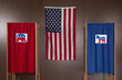 Voting booths and American flag in polling place