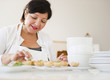 Smiling Hispanic woman baking