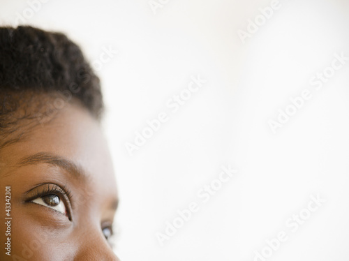 Photo: Close up of Black woman looking upwards Close up of Black woman looking upwards