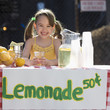 Caucasian girl operating lemonade stand