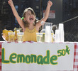 Cheering Caucasian girl operating lemonade stand