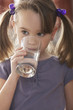 Caucasian girl drinking water