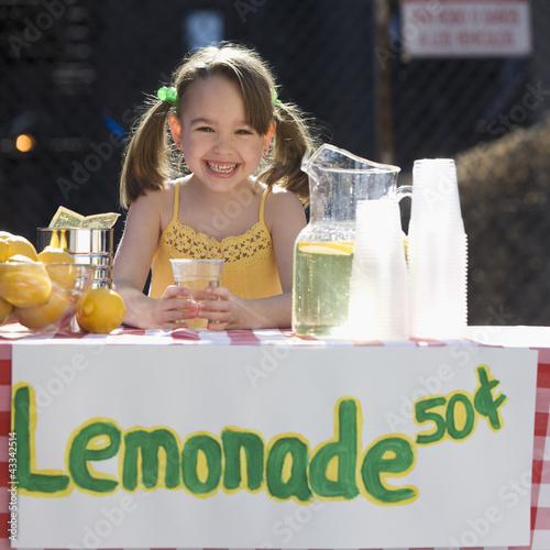 Photo: Caucasian girl operating lemonade stand Caucasian girl operating lemonade stand