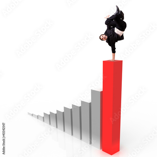 Photo: junger Geschäftsmann macht Handstand auf Statistik junger Geschäftsmann macht Handstand auf Statistik