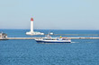Motorboat near lighthouse and pier, Odessa, Ukraine