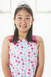 Smiling Chinese girl wearing tiara