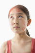 Chinese girl with lipstick kisses on her face