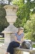 Hispanic woman looking at map in park