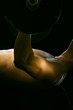 Caucasian man exercising with barbells