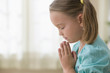 Serious girl praying