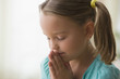 Serious girl praying