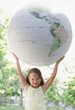 Girl holding large globe