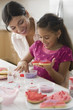 Mother and daughter making Valentine's cookies