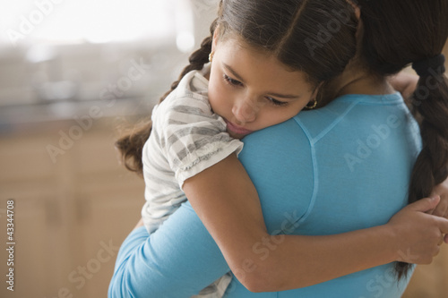 Photo: Mother comforting daughter Mother comforting daughter