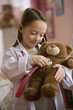 Caucasian girl playing doctor