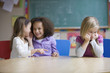 Students whispering in classroom