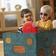 Caucasian boys playing in box