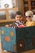 Caucasian boys playing in box