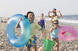 Hispanic family enjoying beach together