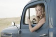 Caucasian woman driving old-fashioned truck