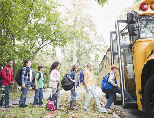 Photo: Children getting onto school bus Children getting onto school bus