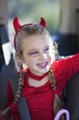 Caucasian girl in devil's costume