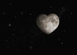 Heart-shaped moon in space