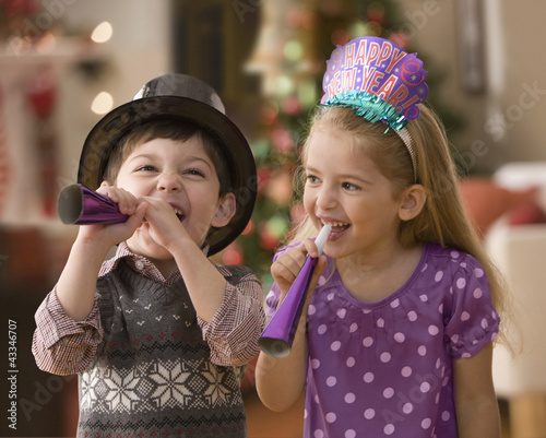 Photo: Boy and girl celebrating New Year's Eve Boy and girl celebrating New Year's Eve