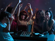 women flirting with dj in night club