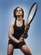 Caucasian woman playing tennis