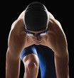 Photo : Caucasian teenage boy in swim cap and goggles Caucasian teenage boy in swim cap and goggles