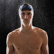 Caucasian teenage boy in swim cap and goggles