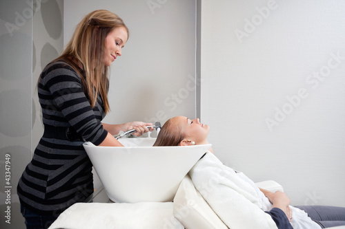 Photo: Woman Getting a Hair Wash Woman Getting a Hair Wash