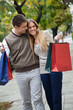Foto: Couple Walking Leisurely On Sidewalk Couple Walking Leisurely On Sidewalk