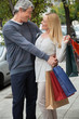 Middle Aged Man Embracing Woman