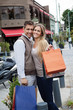 Cheerful Couple With Shopping Bags
