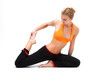 Photo: Younge woman stretching the muscles of her legs Younge woman stretching the muscles of her legs