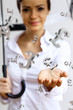 Business woman under money rain with umbrella
