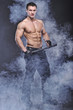 Good looking policeman bodybuilder posing