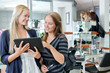 Customer With Hairdresser Holding Digital Tablet