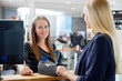 Female Sales Clerk At Counter