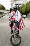 Photo: Patriotic bicyclist dressed in American Flag at early vote for change Presidential rally, October 29, 2008 at Halifax Mall, Government Complex in Raleigh, NC Patriotic bicyclist dressed in American Flag at early vote for change Presidential rally, October 29, 2008 at Halifax Mall, Government Complex in Raleigh, NC
