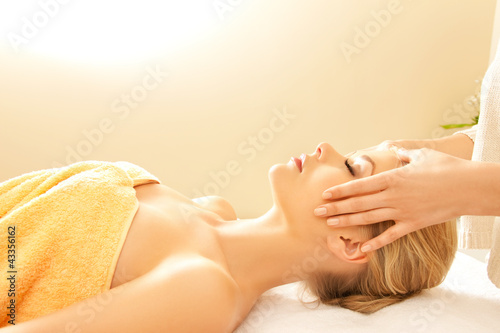 Photo: beautiful woman in massage salon beautiful woman in massage salon